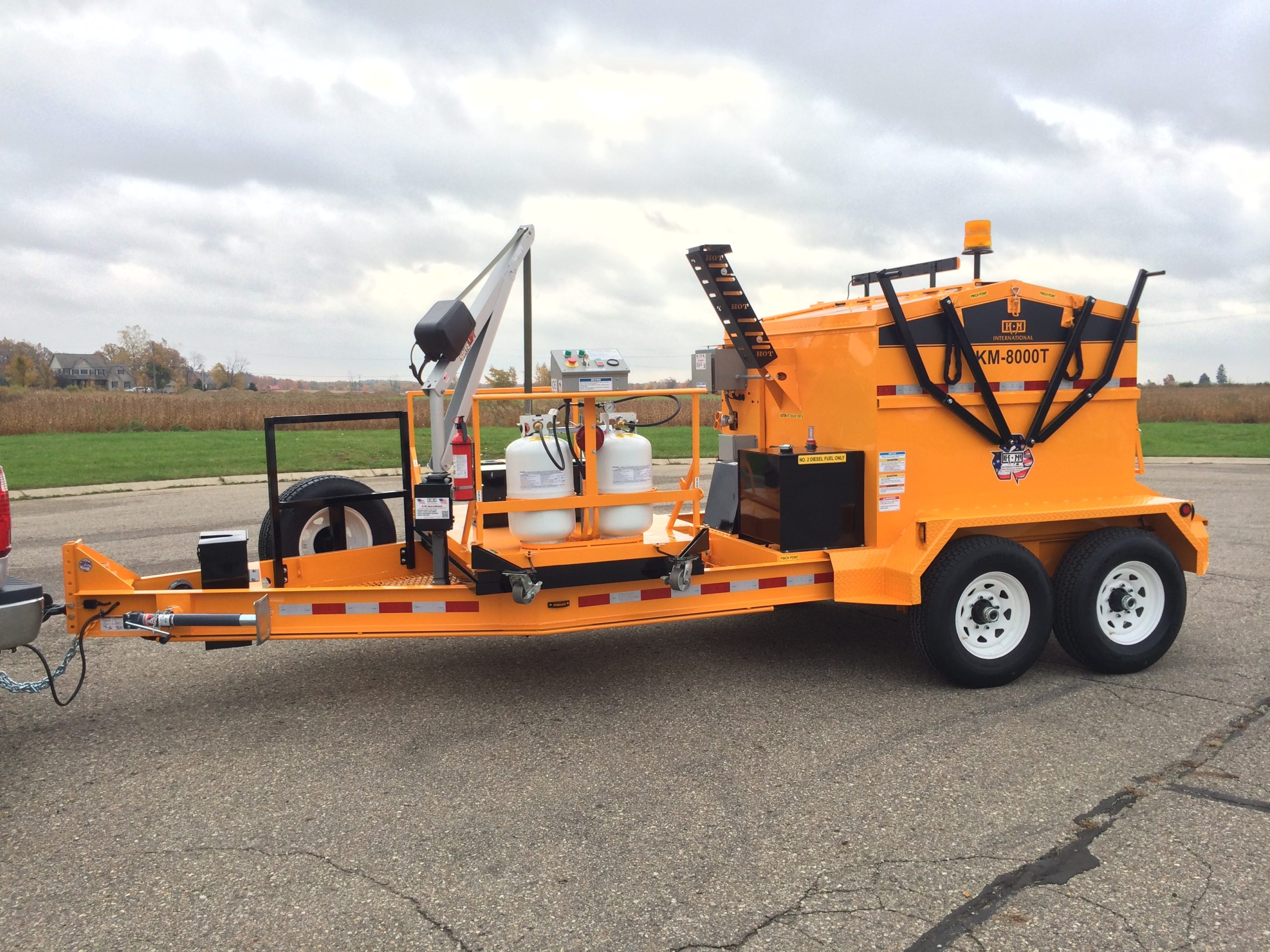 KM International's Asphalt Hotbox Reclaimers can help create long-lasting asphalt repairs.