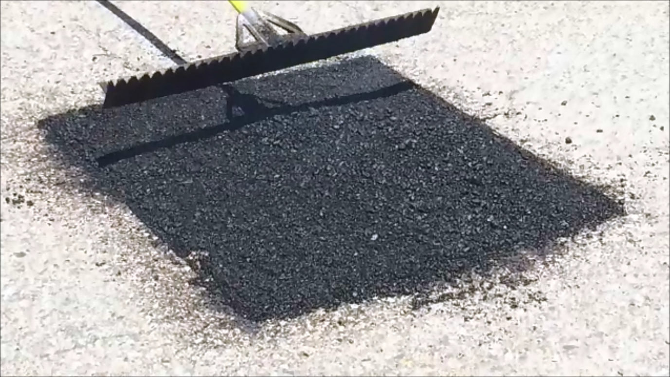 A portable infrared asphalt heater can make road repairs easier.