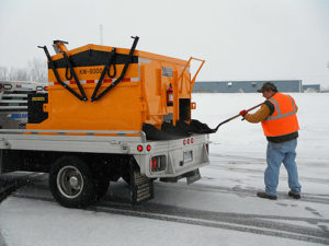 An asphalt hotbox reclaimer enables contractors to continue repairing roads even when they're snow-covered, as shown here.